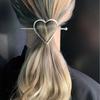 A Stylish And Elegant Golden Hairpin With A Heart Shape Design For Ladies, Suitable For Daily Wear.