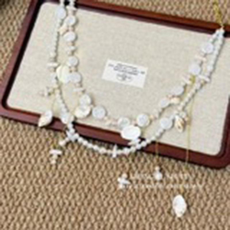 Seaside vacation style pearl shell conch tassel waist chain, casual vacation style, unique belt accessory with a high-end feel