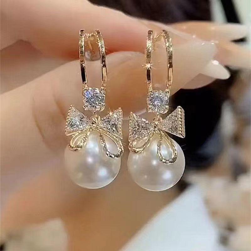 Elegant Red Zirconia Butterfly and Pearl Stud Earrings: Stylish, Versatile, and Fashionable with… More