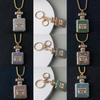 Exquisite Rhinestone-Inlaid Perfume Bottle Pendant Necklace & Car Keychain