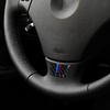 Dekorativt klistermärke i kolfiber för ratt till BMW E90 / E92
