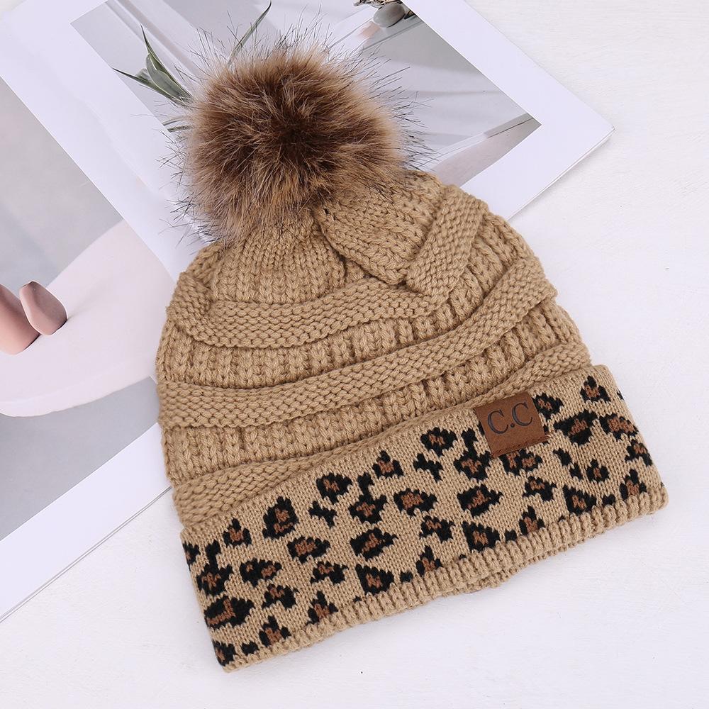 European and American fashion leopard print hairball decoration niche versatile knitted hat autumn and winter travel windproof warm wool hat
