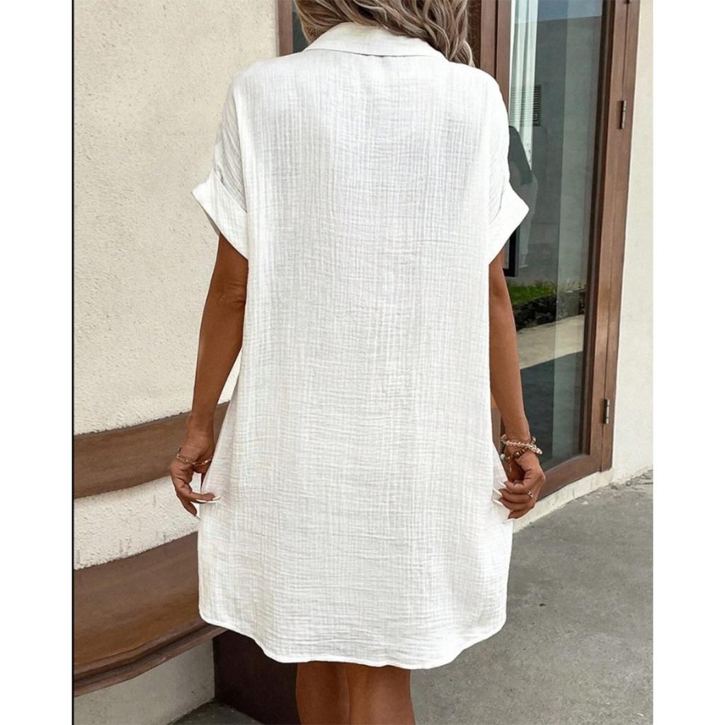 A Simple White Shirt Skirt, Made of Breathable Cotton, with A Streamlined Collar Design and Orderly Button Arrangement, Adding A Vintage Charm
