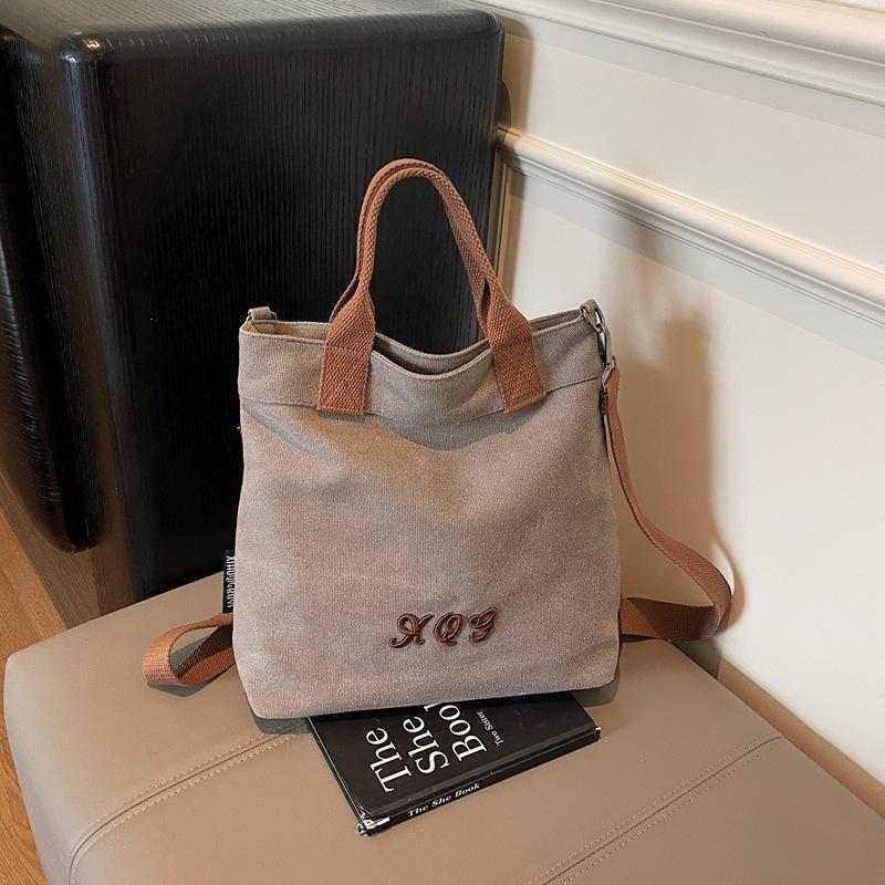 

2025 summer new messenger bag shoulder armpit bag niche design commuter canvas bag fashionable and simple темно-сірий
