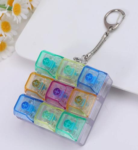 Reißverschluss Vier-Tasten Ein-Schriftzug Mechanische Tastatur, Schaltertester, Fingerquetsch-Musik-Dekompressionsknopf, Schlüsselanhänger, Buntes Glitzern