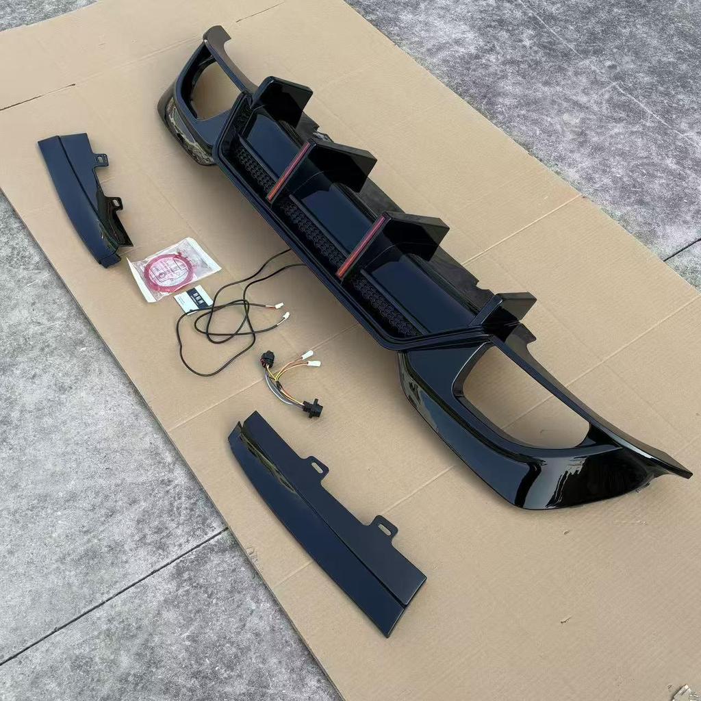 Fit for BMW 3 Series 20-22 G20/G28 Gloss Black Carbon Fiber Rear Diffuser with Dual Vertical Lights.