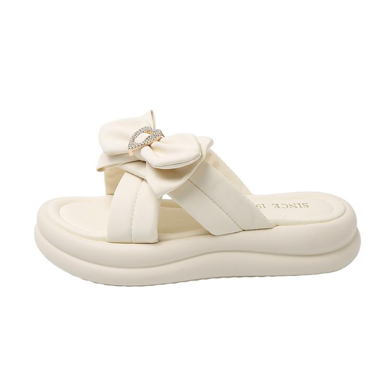Stepping on shit slippers fairy style women's models 2025 summer new models wear thick-bottomed bows with skirts cool slippers
