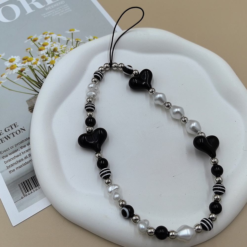 

Черный ремешок для мобильного телефона с бисером и бантом в виде бабочки «Любовь» и глазом дьявола.