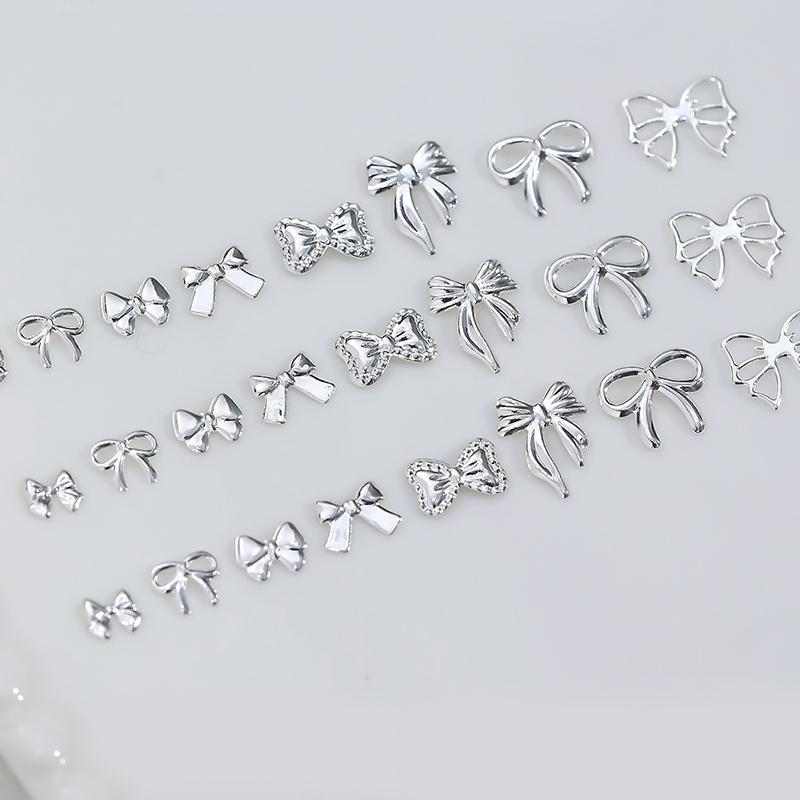 50 st Metalllegering Rosett Naglar Konst Dekoration Silver Guld Nagelberlocker DIY Manikyr Design Smyckestillbehör Verktyg