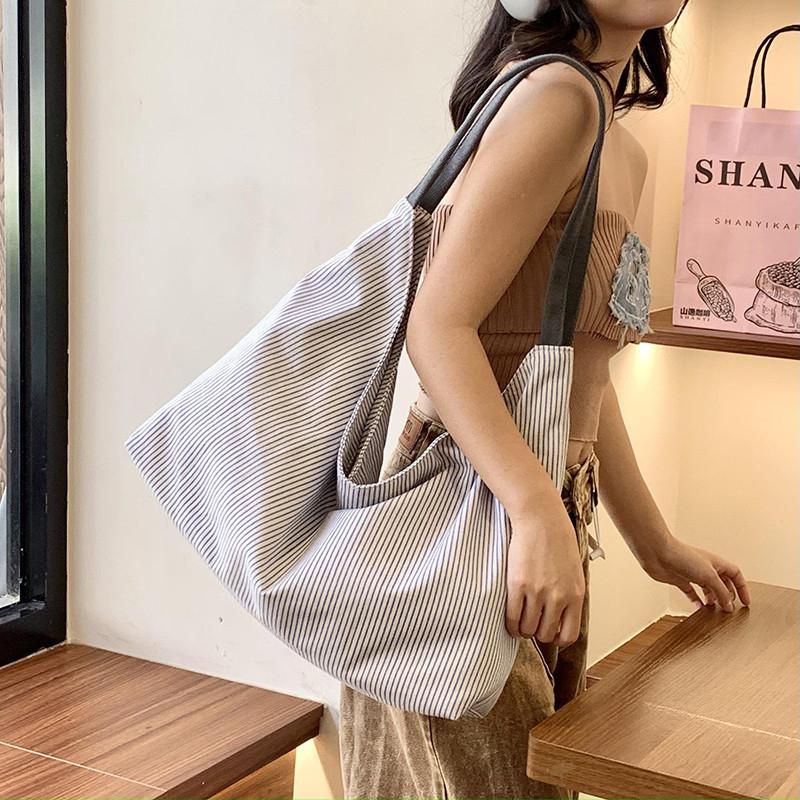 Simple striped canvas bag for women, large-capacity color-blocking tote bag, versatile commuter shoulder bag2026New Handbag