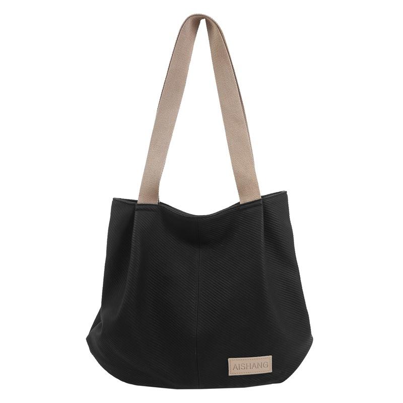 Neue trendige gewebte Muster weiche PU-Schultertasche große Kapazität lässig vielseitig College-Studenten-Klassentasche