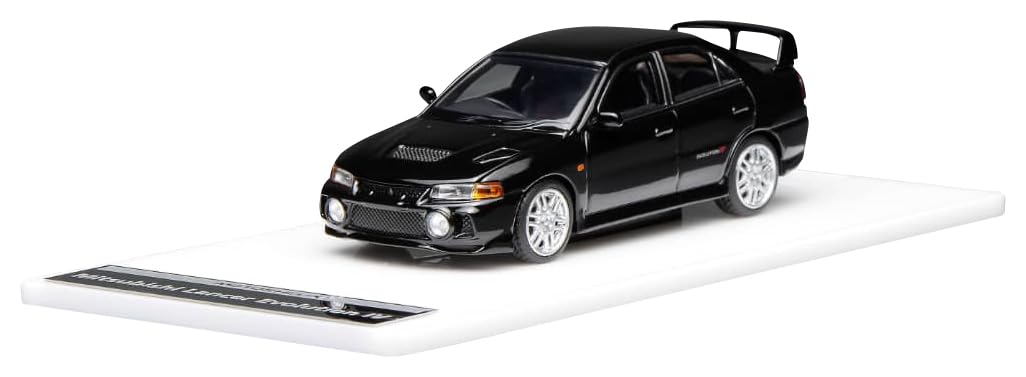 

FREESTYLE MOTORHELIX Mitsubishi Lancer Evolution IV Пиренейский черный перламутр Готовая модель M64004 1/64