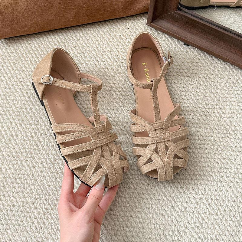 

Woven flat-soled sandals women s summer retro outer wear hollowed-out baotou pig cage shoes one-button Roman shoes 40