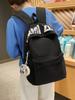 Versatile Letter Print Backpack for Students - Large Capacity for Junior High, High School, University, and Commuting.