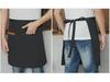 Unisex vanntett kjøkkenforkle i kanvas med halvlangt design og logo i midjen