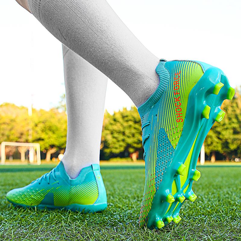 35-45 ახალგაზრდული ფეხბურთის ფეხსაცმელი ხელოვნური საფუარი ამზადებს გარე მამაკაცის გრძელ ფრჩხილის სპორტულ ფეხსაცმელს