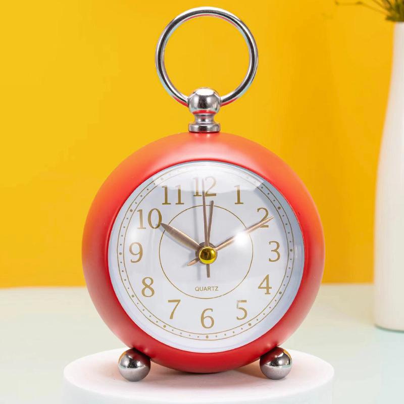 Silent Metal Alarm Clock with Night Light and Gold Stamped Spherical Face - Perfect for Students and Children.