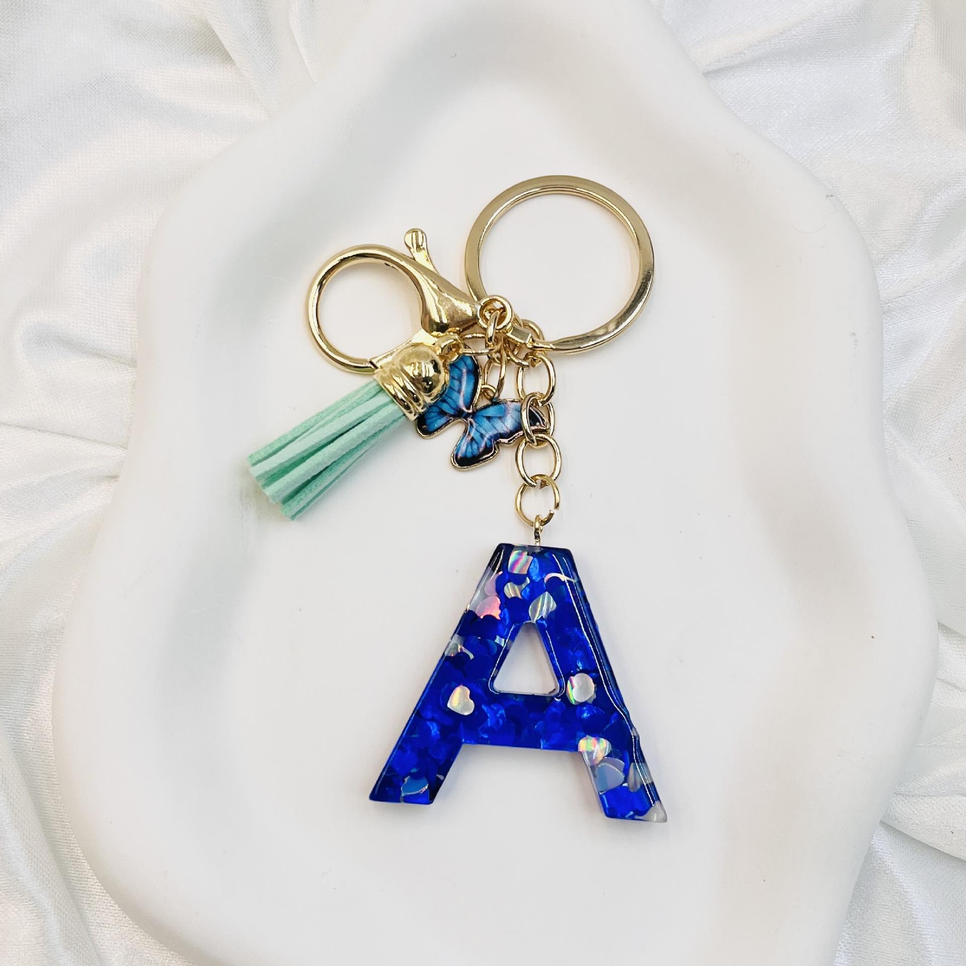 

Blue Resin Lnitial Letter Keychains with Metal Cute Butterfly Tassel Women Men Key Holder Handbag Accessories Bag Keyring Gift