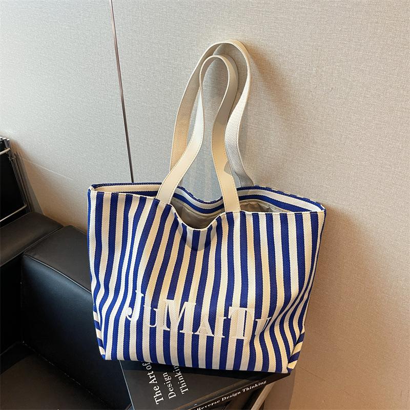 Niche design fashionable striped tote bag women's new large-capacity lazy wind shoulder bag canvas bag