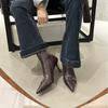 2025 autumn and winter new brown pointed metal buckle high heel thin boots women's soft leather short boots