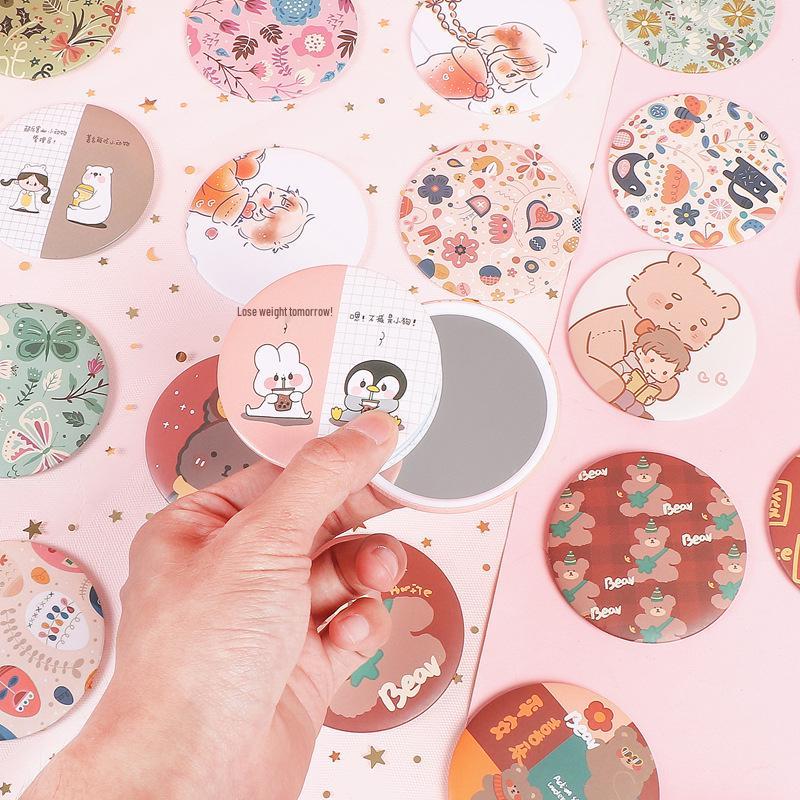 Mini Creative Cartoon Makeup Mirror for Girls - Cute, Portable, Round, and Customizable.
