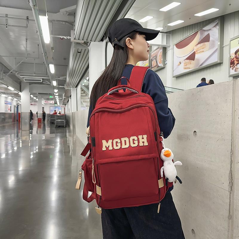 Schoolbag Japanese new solid color simple campus junior high school schoolbag Korean version girl backpack women's large capacity travel backpack