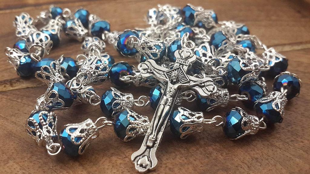 Catholic necklace with deep blue crystal crown beads, rosary, sacred earth medal and cross.