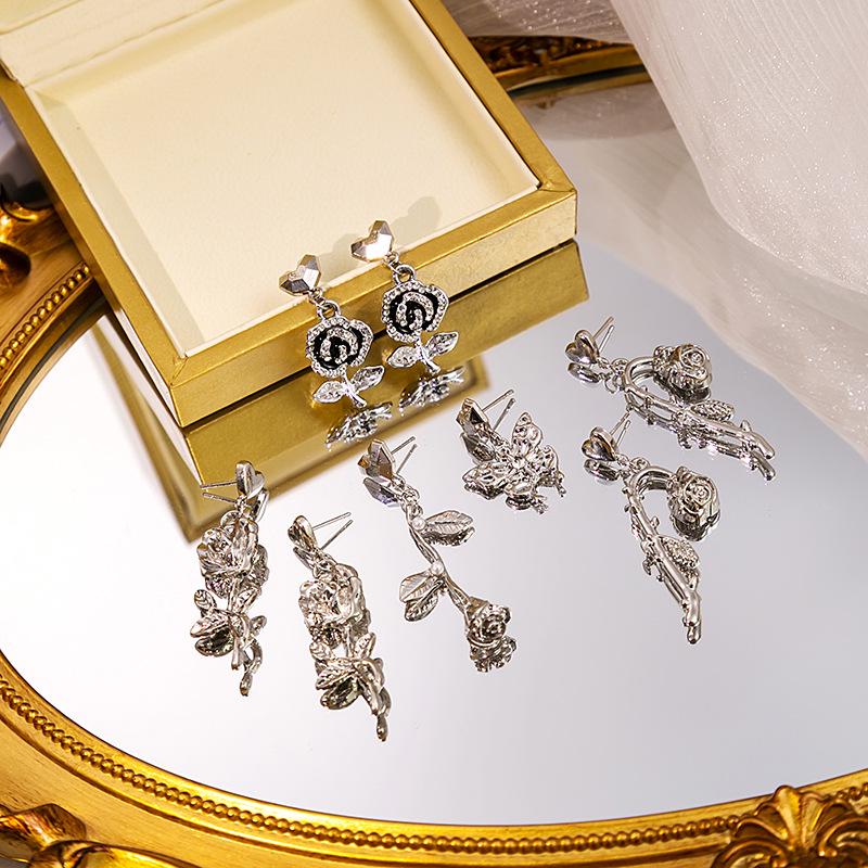 

Silver Needle Korean Rose Pearl Earrings with Rhinestone Butterfly Tassel