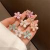 5/10PCS.Spring Camellia Hollow Small Claw Clips for Kids. Minimalist Floral Design, Durable Metal Texture, Secures Bangs Well.