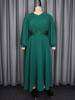 Plus Size Emerald Green Sequin Waist-Cinched Long Pleated Dress with Wide-Hem Skirt and Long Sleeves for Formal Banquets.