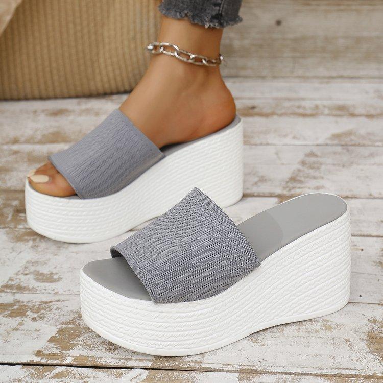 2025 summer new large size solid color wedge heel one-word slippers women wear thick-soled knitted mesh wedge heel cool slippers