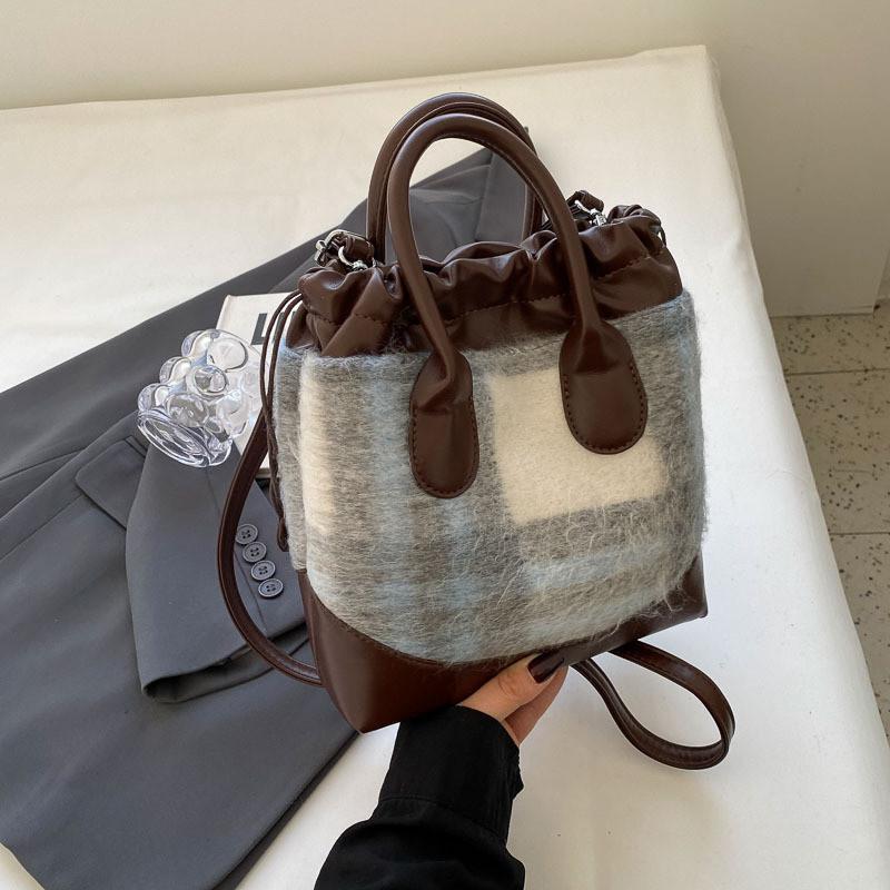2023 Neue Koreanische Farbblock-Freizeit-Tasche Vintage-Mode Woll-Eimer-Tasche Grenzüberschreitender Trend-Stil