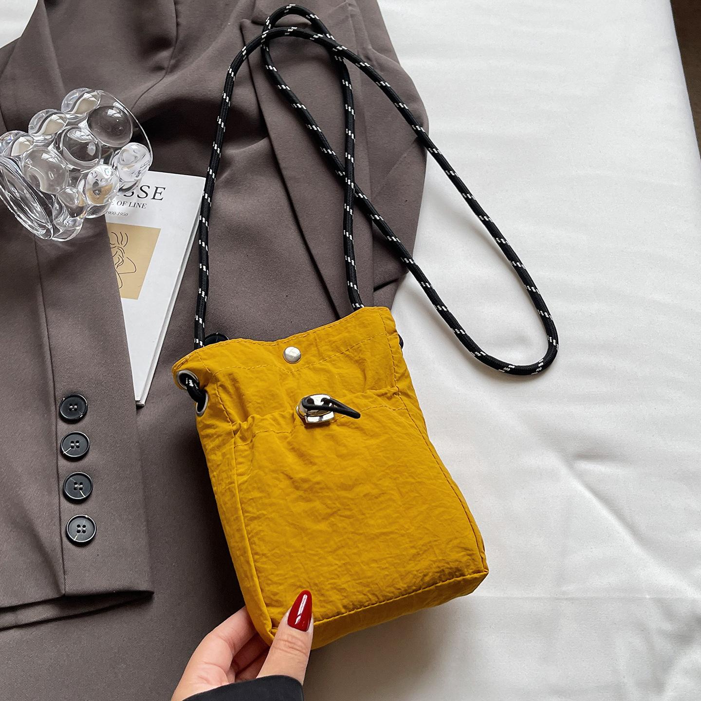 

ins shoulder messenger bag drawstring small bag 2026 niche sense fashion lightweight mini mobile phone nylon bag women
