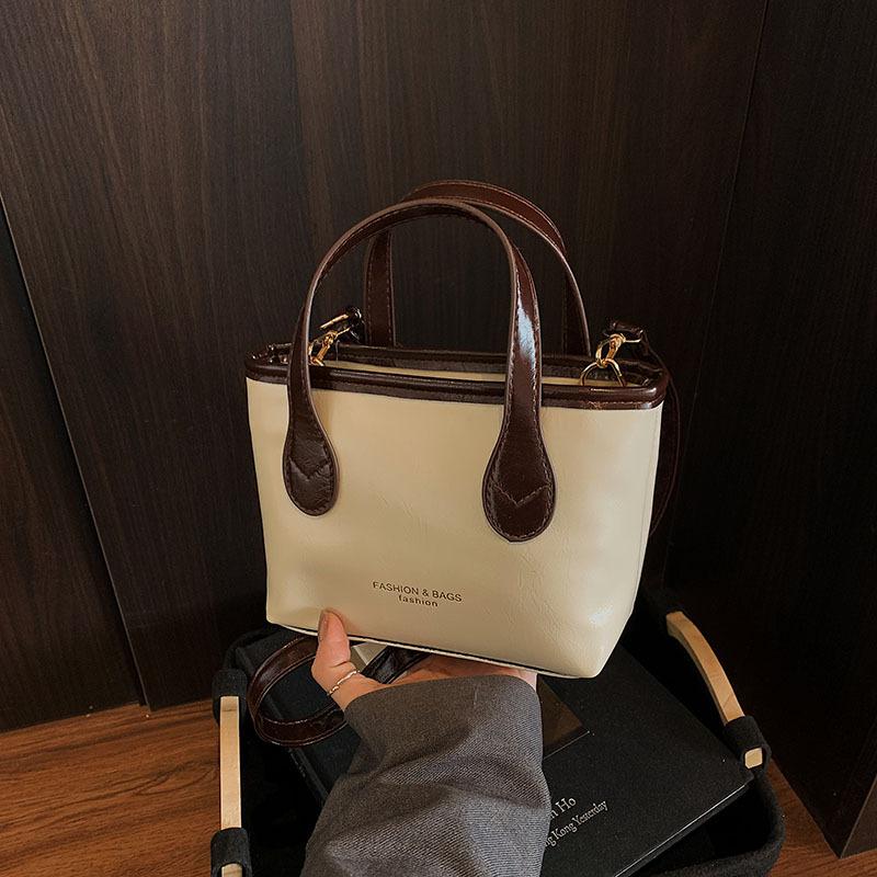 

Популярная новая модная весенняя сумка-тоут через плечо с текстурой, сочетающая цвета, портативная, с подвеской