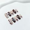 Cow Print Pearl Bow Nail Art Tips In Elegant Brown Tones