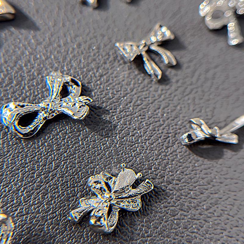 10 ks Jednoduché Tenké Mašličky Stříbrné Kroucené Slitiny Ozdoby na Nehty Manicura Přívěsky