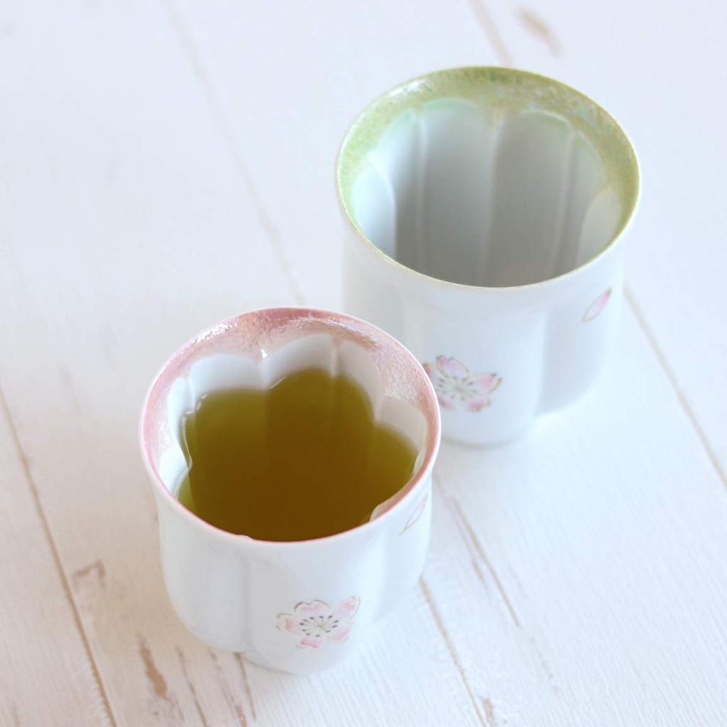 A perfect retirement gift for A pair of teacups with a floating cherry blossom Made in these Arita ware teacups make a perfect couples. design. Japan,