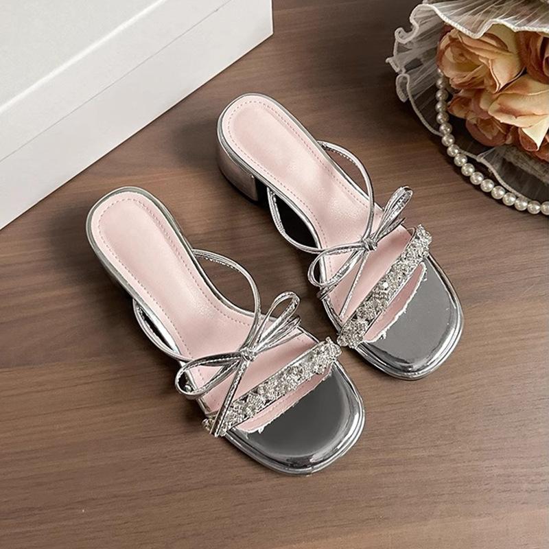 

Bow silver high-heeled sandals women s 2025 summer new French cool slippers wearing rhinestone temperament one-word drag 42