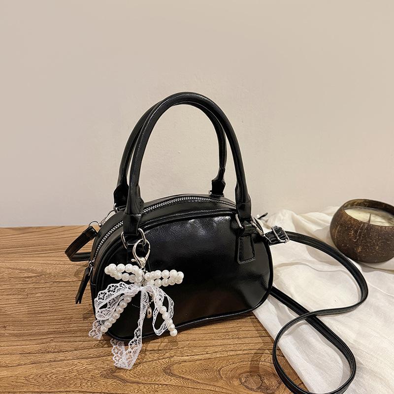 Neue Nischendesign modische Textur Handtasche Bowlingtasche Damen vielseitige Schulter Umhängetasche