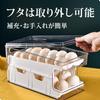 Egg tray for refrigerator, holds 24 eggs, automatic refilling, 2-tier design, sliding lid, convenient storage.