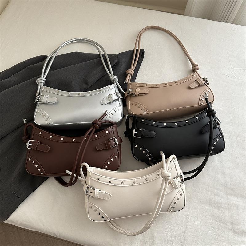 Retro fashion underarm bag women's new trendy rivet locomotive bag high-end niche versatile baguette bag