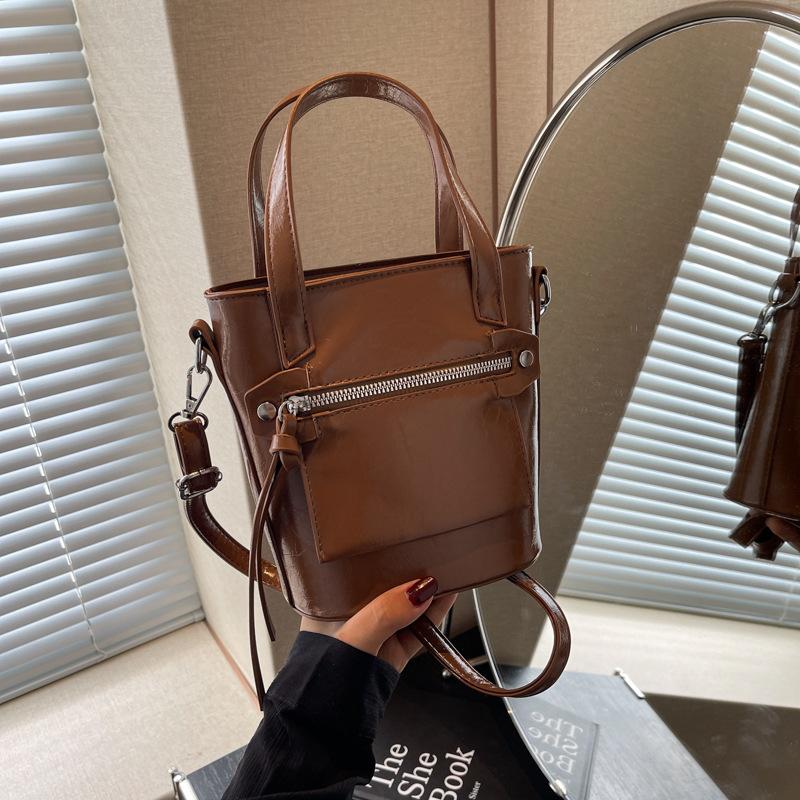 

Популярні цього року ретро-сумки осінь і зима 2024 нова мода нішеві сумки-месенджери жіночі портативні сумки-відра коричневий