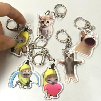 Porte-clés Chat Heureux Banane Acrylique Porte-clés Meme Drôle Pendentif Suspendu Sac à Dos Charms pour Téléphone Portable Porte-clés Mignon Accessoires