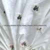 Light Apricot Cotton Fabric with Small Embroidered Flowers - Fresh Style for Women's Clothing and Children's Bags.