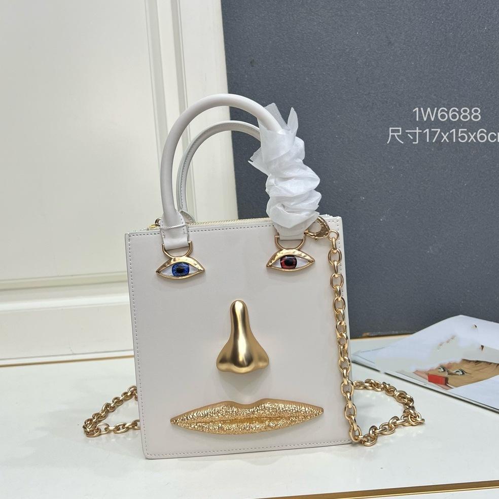 26 trendy new schiap face women's bag plain weave cowhide chain design sense hand-held tote bag