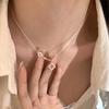 Elegant Hollow Four-Leaf Pendant Necklace for Women – Light Luxury Fashion Choker, Clavicle Chain, Versatile and Trendy.