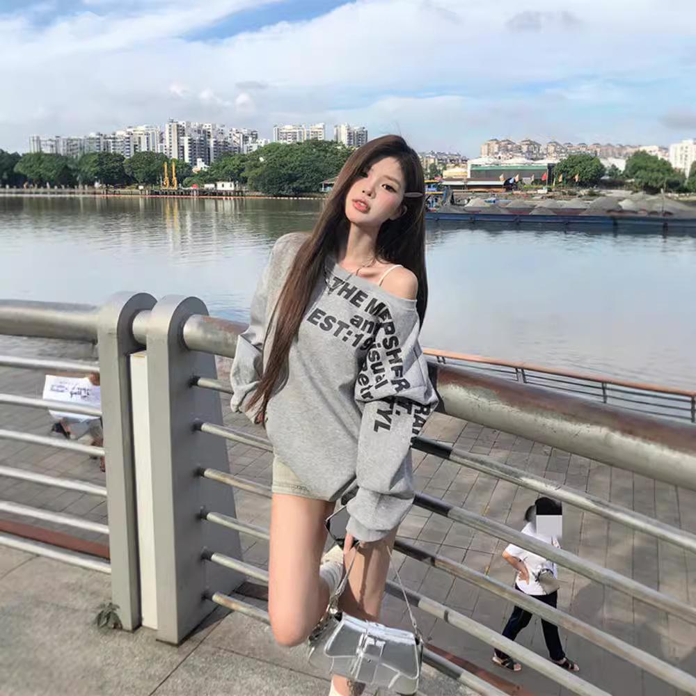 American-Style Oversized Off-Shoulder Sweater: Letter Print, Long Sleeve, Casual Loose Fit for Women In Early Autumn.