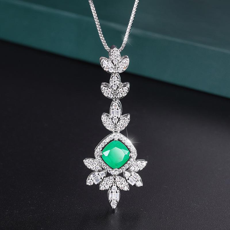 

Ювелирные изделия Покрытая настоящим золотом медь Имитация ветра Изумрудные серьги-подвески Женский набор Главный камень 8 * 8