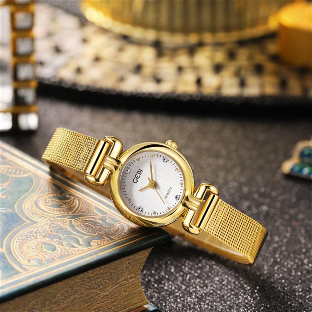 Nischen High-End Damenuhr Stoffmuster Kleines rundes Zifferblatt Mesh-Armbanduhr Wasserdichte Quarz Damenuhr Mittelalterliche Uhr