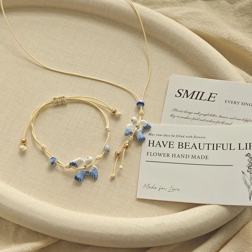 Artistic Small Blue & White Ceramic Bird Pendant Bracelet with Adjustable Woven Cord - Fresh Forest Style for Women